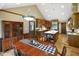 Well-lit kitchen featuring custom wood cabinets and eat in dining area at 6118 Deerwood Dr, Greenwood, IN 46143