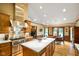 Well-equipped kitchen with a large island and modern stainless hood at 6118 Deerwood Dr, Greenwood, IN 46143