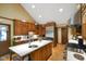 Large open kitchen with island, stainless appliances, and hardwood floors at 6118 Deerwood Dr, Greenwood, IN 46143