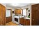 Well-equipped laundry room with modern appliances, sink, and ample cabinet space at 6118 Deerwood Dr, Greenwood, IN 46143