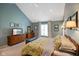Well-lit main bedroom with vaulted ceilings, a ceiling fan, and a dresser with a TV at 6118 Deerwood Dr, Greenwood, IN 46143