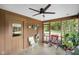 Relaxing screened porch with ceiling fan and views of the surrounding landscape at 6118 Deerwood Dr, Greenwood, IN 46143