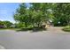 Street view of home showing mature trees and landscaping at 6118 Deerwood Dr, Greenwood, IN 46143