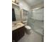 Modern bathroom features a vanity with sink, toilet, and a glass-enclosed shower at 613 Monte Vista Dr, Greenwood, IN 46143