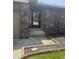 Close up shot of the front entrance and partial brickwork, showcasing the walkway entrance at 613 Monte Vista Dr, Greenwood, IN 46143