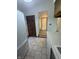 Bright kitchen featuring white appliances, tiled flooring, and wooden cabinets for ample storage at 613 Monte Vista Dr, Greenwood, IN 46143