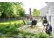 Spacious backyard with patio and garden furniture and large lawn at 6563 Enclave Blvd, Greenwood, IN 46143