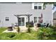 Large backyard patio with dining and lounging furniture, grill, and plenty of garden space at 6563 Enclave Blvd, Greenwood, IN 46143