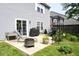 Cozy backyard patio with grill, fire pit, seating area, and plenty of garden space at 6563 Enclave Blvd, Greenwood, IN 46143