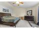 Spacious bedroom with natural light, and plenty of room for your storage and comfort with a cozy bed at 6563 Enclave Blvd, Greenwood, IN 46143