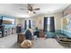 Spacious bonus room with a TV, ceiling fan, and furniture and multiple windows and wall art at 6563 Enclave Blvd, Greenwood, IN 46143