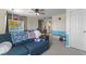 Spacious bonus room with a ceiling fan, furniture and multiple windows and wall art at 6563 Enclave Blvd, Greenwood, IN 46143