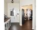 Inviting entryway with dark wood floors and a view into an office space, creating a warm welcome at 6563 Enclave Blvd, Greenwood, IN 46143