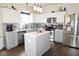 Modern kitchen with stainless steel appliances, white cabinets, and a functional center island at 6563 Enclave Blvd, Greenwood, IN 46143