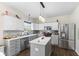 Modern kitchen with stainless steel appliances, center island and pendant lighting at 6563 Enclave Blvd, Greenwood, IN 46143