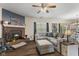 Cozy living room with a brick fireplace, hardwood floors and comfortable seating at 6563 Enclave Blvd, Greenwood, IN 46143