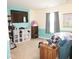 Comfortable living room with TV, bookshelves, neutral carpet and ample storage space at 6563 Enclave Blvd, Greenwood, IN 46143
