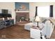Inviting living room showcasing a brick fireplace, large windows, and comfortable seating at 6563 Enclave Blvd, Greenwood, IN 46143