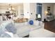 Open-concept living room seamlessly connects to the kitchen, creating a harmonious and spacious atmosphere at 6563 Enclave Blvd, Greenwood, IN 46143