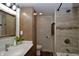 Updated bathroom featuring a vanity, toilet, and walk-in shower with modern tile at 7150 Combs Rd, Indianapolis, IN 46237
