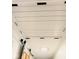 Finished basement ceiling with exposed beams and track lighting at 7150 Combs Rd, Indianapolis, IN 46237