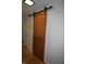 Stylish sliding barn door to the basement at 7150 Combs Rd, Indianapolis, IN 46237
