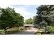 Well-maintained home with mature trees, fresh landscaping, and a convenient paved driveway at 7150 Combs Rd, Indianapolis, IN 46237