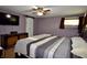 Relaxing main bedroom with large bed, television and ensuite bathroom at 7150 Combs Rd, Indianapolis, IN 46237