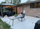 Patio with a table and chairs is perfect for outdoor relaxing and entertaining at 7150 Combs Rd, Indianapolis, IN 46237