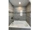 Close-up of the walk-in shower featuring modern tile and a built-in niche at 7150 Combs Rd, Indianapolis, IN 46237
