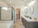 Modern bathroom featuring double vanity, glass enclosed shower, tile flooring and a walk-in closet at 7284 Bayview Run, McCordsville, IN 46055