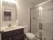 Bathroom featuring a modern vanity and glass-enclosed shower at 7284 Bayview Run, McCordsville, IN 46055