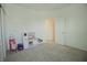 Well-lit bedroom with carpet, playroom area, and a closet, providing a versatile space for children at 7284 Bayview Run, McCordsville, IN 46055