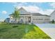 Charming single-Gathering home with a manicured lawn and a three-car garage at 7284 Bayview Run, McCordsville, IN 46055
