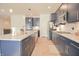 Spacious kitchen with stainless steel appliances, granite countertops, subway tile backsplash, and ample storage at 7284 Bayview Run, McCordsville, IN 46055