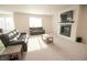 Open living room featuring comfortable seating, a fireplace, mounted TV, and ample natural light for a cozy atmosphere at 7284 Bayview Run, McCordsville, IN 46055