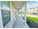 View of the front porch with white columns and stone accents at 7284 Bayview Run, McCordsville, IN 46055