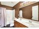 Neutral bathroom featuring a shower-tub combo, dual sink vanity, and a large mirror at 7337 Wythe Dr, Noblesville, IN 46062