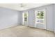 This bedroom has a ceiling fan and two windows that look out into the yard at 7337 Wythe Dr, Noblesville, IN 46062