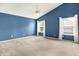 Spacious bedroom features vaulted ceilings, carpeting, and large windows with white curtains at 7337 Wythe Dr, Noblesville, IN 46062