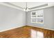 Dining room with tray ceiling, wood floors, and window with natural light at 7337 Wythe Dr, Noblesville, IN 46062