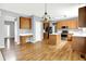 Well-lit eat-in kitchen with wood cabinets, a center island, and stainless-steel appliances at 7337 Wythe Dr, Noblesville, IN 46062