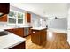 Well-lit kitchen features an island, wood cabinets, stainless steel appliances, and an eat-in area at 7337 Wythe Dr, Noblesville, IN 46062