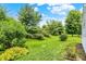Expansive backyard with mature trees and lush greenery offering privacy and a serene outdoor space at 8038 Sydney Ln, Avon, IN 46123