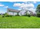 The property features a large, well-maintained lawn and a detached home for optimal outdoor relaxation at 8038 Sydney Ln, Avon, IN 46123
