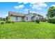 Spacious backyard featuring a lush green lawn, mature trees and shrubs, offering a private outdoor retreat at 8038 Sydney Ln, Avon, IN 46123