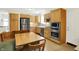 Beautiful kitchen with stainless steel appliances, cabinetry, and an adjacent dining area at 8038 Sydney Ln, Avon, IN 46123
