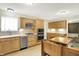 Well-equipped kitchen featuring stainless steel appliances and ample cabinet space at 8038 Sydney Ln, Avon, IN 46123