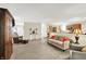 Spacious living room with comfortable seating and an open flow to the kitchen area at 8038 Sydney Ln, Avon, IN 46123