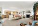 Open-concept living room with a fireplace and views into the kitchen at 8038 Sydney Ln, Avon, IN 46123